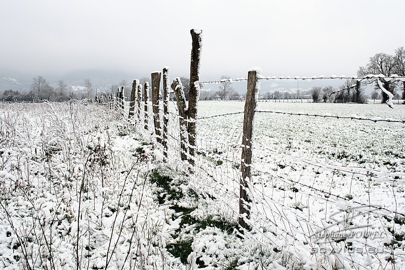 Photo clôture enneigée